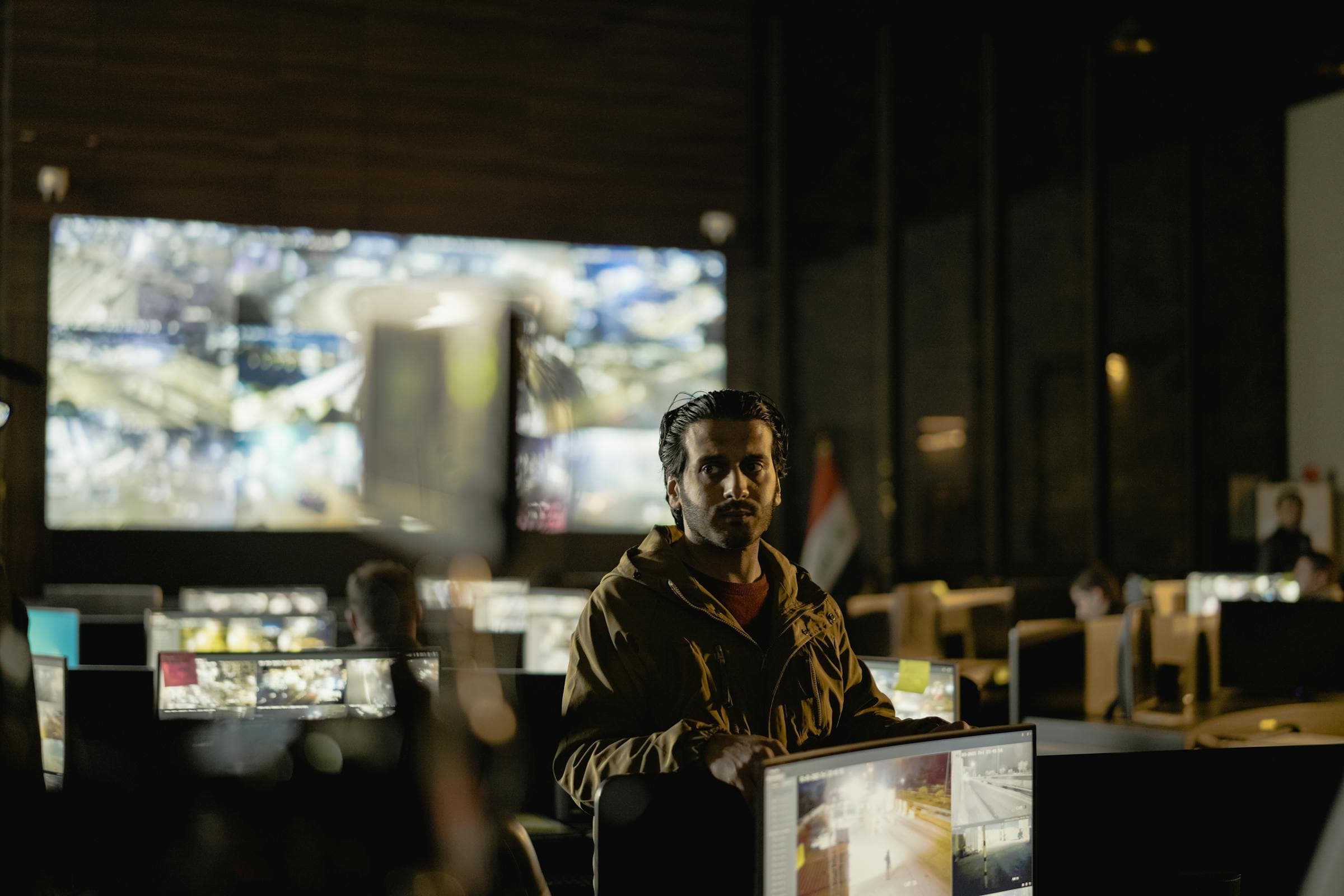 Security control room with a video wall of surveillance feeds